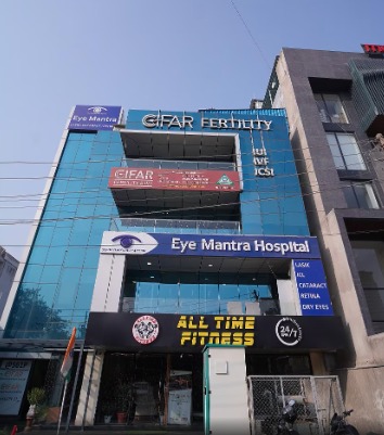 Front view of EyeMantra Hospital building in Gurgaon with optical shop and eye treatment services signage.