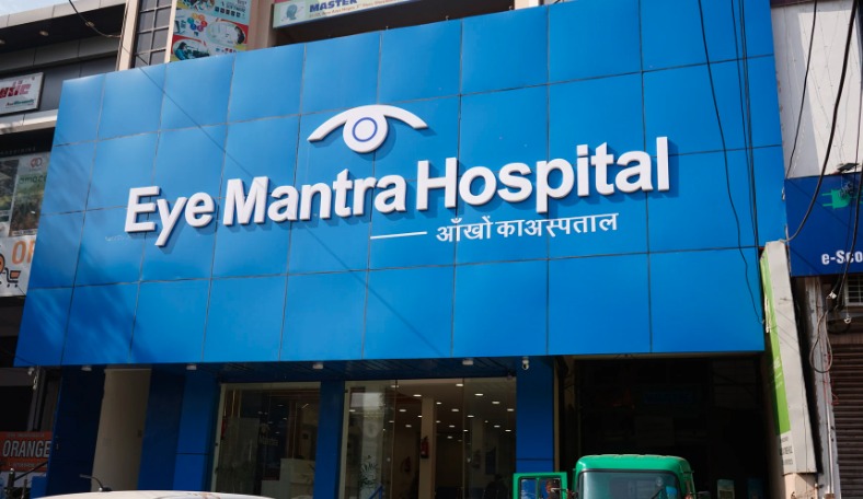 Front entrance of EyeMantra Hospital and Optical Shop in Ghaziabad with blue branding board