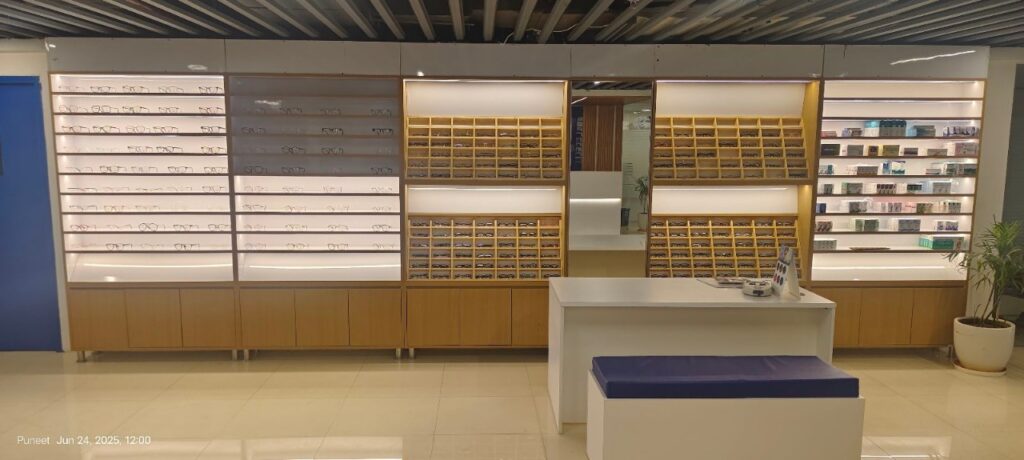 Display shelves with eyeglasses and contact lenses at EyeMantra Optical store in Delhi
